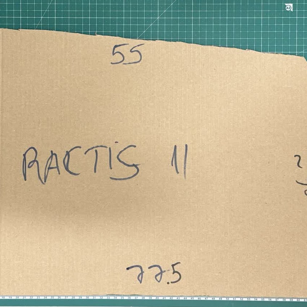 A finished cardboard window template hand-labelled RACTIS 11 with edge measurements in marker