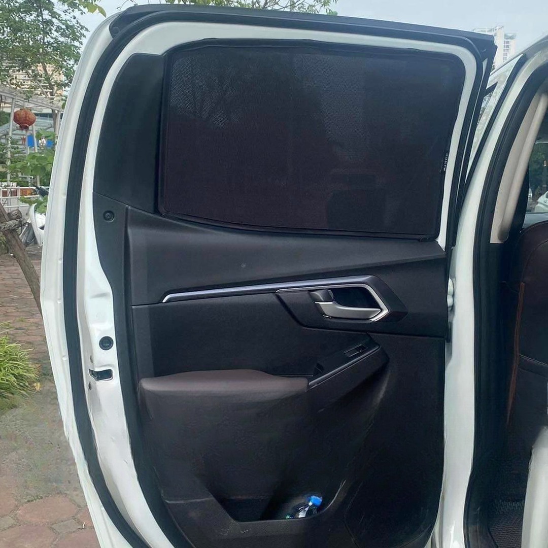 Custom-fit magnetic sun shades fitted to an Isuzu D-MAX dual cab