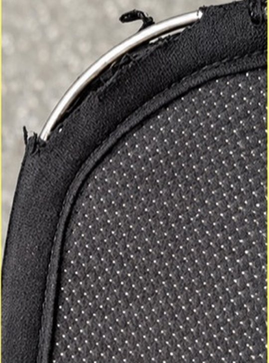 A round steel frame sitting inside intact fabric binding