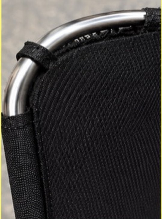 A round stainless frame sitting in undamaged mesh at the corner of a shade